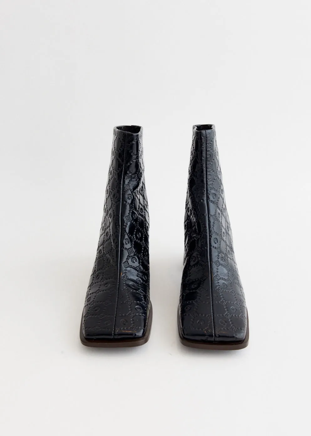 Moonogram Embossed Leather Block Boots Transparent Pvc